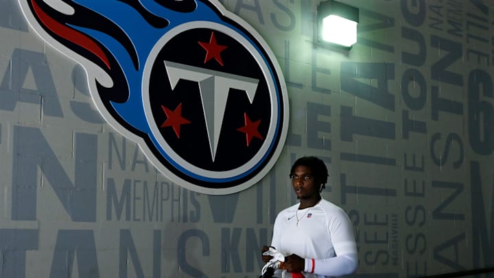 Tennessee Titans quarterback Cam Ward walks to the field for a “Back Together Weekend” training camp practice. Tennessee Titans quarterback Cam Ward walks to the field for a “Back Together Weekend” training camp practice.