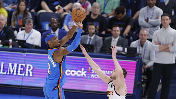Mar 9, 2026; Oklahoma City, Oklahoma, USA; Oklahoma City Thunder guard Shai Gilgeous-Alexander (2) shoots over Denver Nuggets guard Christian Braun (0) during the second half at Paycom Center. Mandatory Credit: Alonzo Adams-Imagn Images