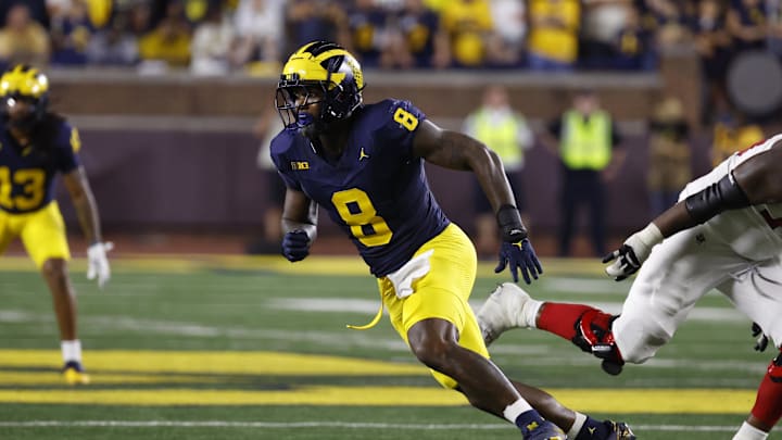 Aug 31, 2024; Ann Arbor, Michigan, USA; Michigan Wolverines defensive end Derrick Moore (8) pursues a play against the Fresno State Bulldogs at Michigan Stadium. Mandatory Credit: Rick Osentoski-Imagn Images Aug 31, 2024; Ann Arbor, Michigan, USA; Michigan Wolverines defensive end Derrick Moore (8) pursues a play against the Fresno State Bulldogs at Michigan Stadium. Mandatory Credit: Rick Osentoski-Imagn Images