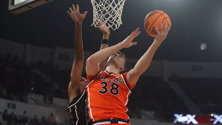 Feb 18, 2026; Starkville, Mississippi, USA; Auburn Tigers forward Filip Jovic (38) shoots as Mississippi State Bulldogs forward Jamarion Davis-Fleming (0) defends during the first half at Humphrey Coliseum. Mandatory Credit: Petre Thomas-Imagn Images