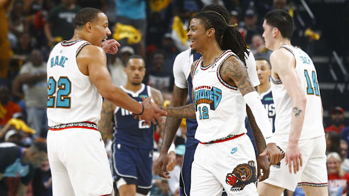 Apr 18, 2025; Memphis, Tennessee, USA; Memphis Grizzlies guard Ja Morant (12) reacts with guard Desmond Bane (22) during the first quarter against the Dallas Mavericks at FedExForum. Mandatory Credit: Petre Thomas-Imagn Images Apr 18, 2025; Memphis, Tennessee, USA; Memphis Grizzlies guard Ja Morant (12) reacts with guard Desmond Bane (22) during the first quarter against the Dallas Mavericks at FedExForum. Mandatory Credit: Petre Thomas-Imagn Images