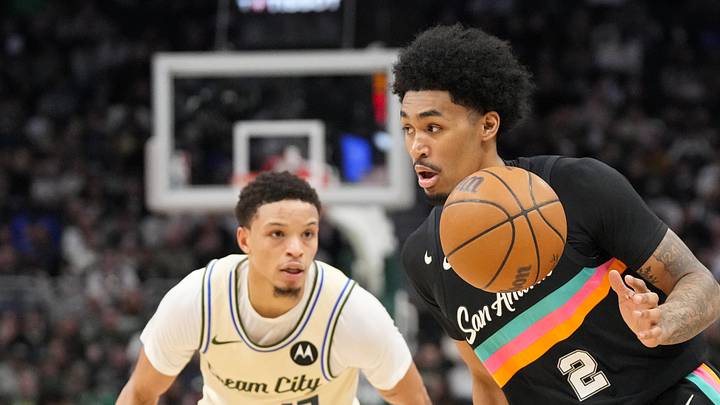 Mar 28, 2026; Milwaukee, Wisconsin, USA; San Antonio Spurs guard Dylan Harper (2) drives towards the basket in front of Milwaukee Bucks guard Ryan Rollins (13) during the second quarter at Fiserv Forum. Mandatory Credit: Jeff Hanisch-Imagn Images Mar 28, 2026; Milwaukee, Wisconsin, USA; San Antonio Spurs guard Dylan Harper (2) drives towards the basket in front of Milwaukee Bucks guard Ryan Rollins (13) during the second quarter at Fiserv Forum. Mandatory Credit: Jeff Hanisch-Imagn Images