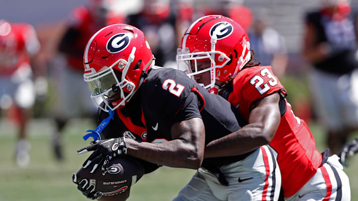 Georgia wide receiver Nitro Tuggle (2) catches a pass from Georgia quarterback Gunner Stockton (14) during the G-Day spring football game in Athens, Ga., on Saturday, April 13, 2024. The game ended in a tie.