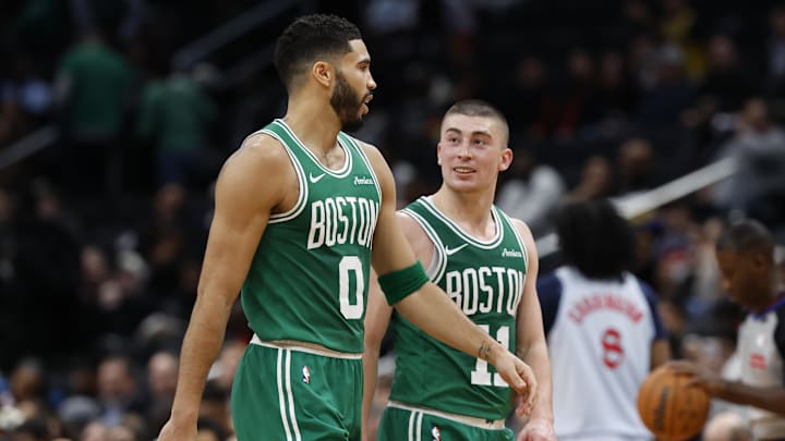 Dec 15, 2024; Washington, District of Columbia, USA; Boston Celtics forward Jayson Tatum (0) talks with Celtics guard Payton Pritchard (11) during a timeout against the Washington Wizards in the third quarter at Capital One Arena. Mandatory Credit: Geoff Burke-Imagn Images