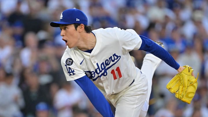Oct 16, 2025; Los Angeles, California, USA; Los Angeles Dodgers pitcher Roki Sasaki (11) pitches in the ninth inning against the Milwaukee Brewers during game three of the NLCS round for the 2025 MLB playoffs at Dodger Stadium. Mandatory Credit: Jayne Kamin-Oncea-Imagn Images
