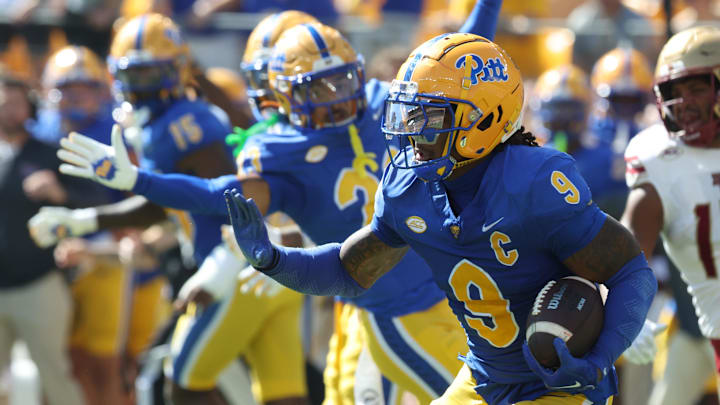 Oct 4, 2025; Pittsburgh, Pennsylvania, USA;  Pittsburgh Panthers linebacker Kyle Louis (9) runs after fumble recovery against the Boston College Eagles during the second quarter at Acrisure Stadium. Mandatory Credit: Charles LeClaire-Imagn Images