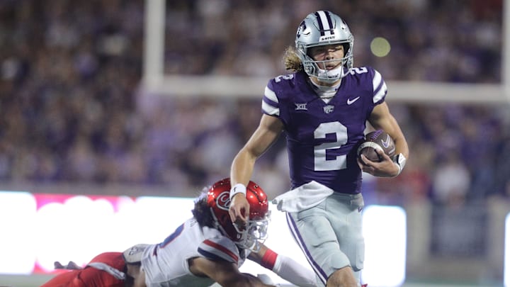 Kansas State Wildcats quarterback Avery Johnson (2) runs the ball during the fourth quarter of the game against Arizona at Bill Snyder Family Stadium on Friday, September 13, 2024. Kansas State Wildcats quarterback Avery Johnson (2) runs the ball during the fourth quarter of the game against Arizona at Bill Snyder Family Stadium on Friday, September 13, 2024.