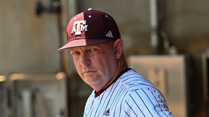 Jun 8, 2024; College Station, TX, USA; Texas A&M head coach Jim Schlossnagle looks on from the dugout prior to the game against the Oregon at Olsen Field, Blue Bell Park. Jun 8, 2024; College Station, TX, USA; Texas A&M head coach Jim Schlossnagle looks on from the dugout prior to the game against the Oregon at Olsen Field, Blue Bell Park.