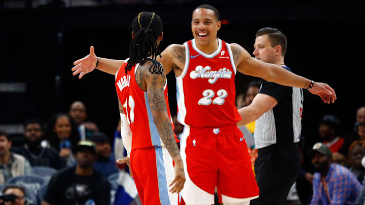 Apr 1, 2025; Memphis, Tennessee, USA; Memphis Grizzlies guard Desmond Bane (22) reacts with guard Ja Morant (12) during the third quarter against the Golden State Warriors at FedExForum. Mandatory Credit: Petre Thomas-Imagn Images