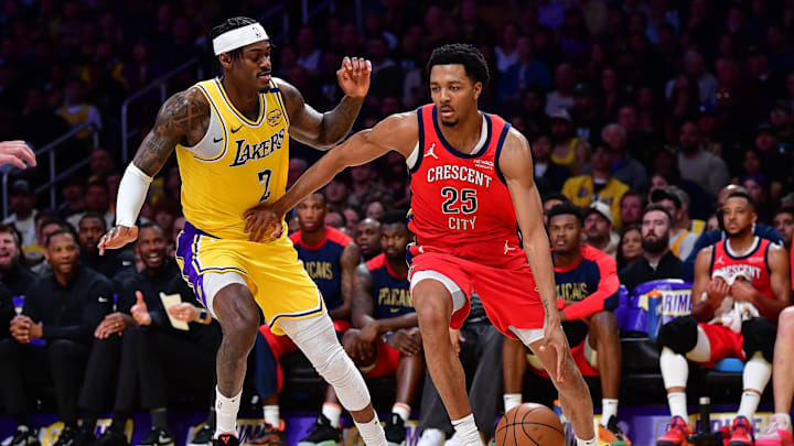 Mar 4, 2025; Los Angeles, California, USA; New Orleans Pelicans guard Trey Murphy III (25) moves the ball against Los Angeles Lakers forward Jarred Vanderbilt (2) during the second half at Crypto.com Arena. Mandatory Credit: Gary A. Vasquez-Imagn Images