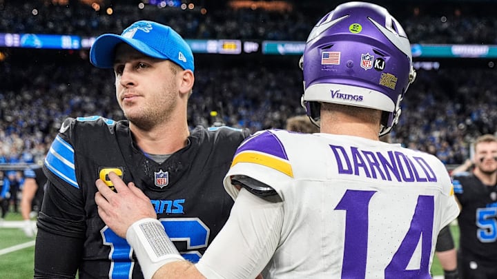 Detroit Lions quarterback Jared Goff (16) hugs Minnesota Vikings quarterback Sam Darnold (14) after 31-9 win at Ford Field in Detroit on Sunday, Jan. 5, 2025.