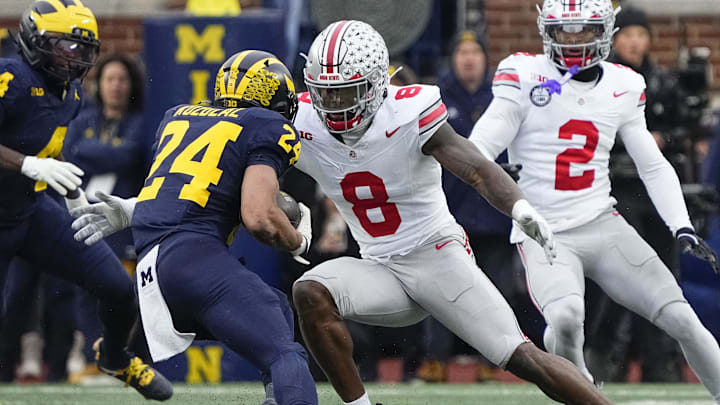 Ohio State Buckeyes linebacker Arvell Reese (8) tackles Michigan Wolverines running back Bryson Kuzdzal (24) during the NCAA football game at Michigan Stadium in Ann Arbor, Mich. on Nov. 29, 2025. Ohio State won 27-9.