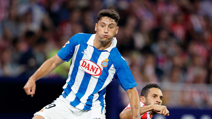 Alejo Veliz duelling with Atletico Madrid captain Koke