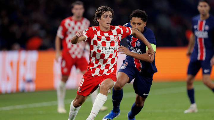 Bryan Gil attempts to escape the attention of Marquinhos at the Parc Des Princes 