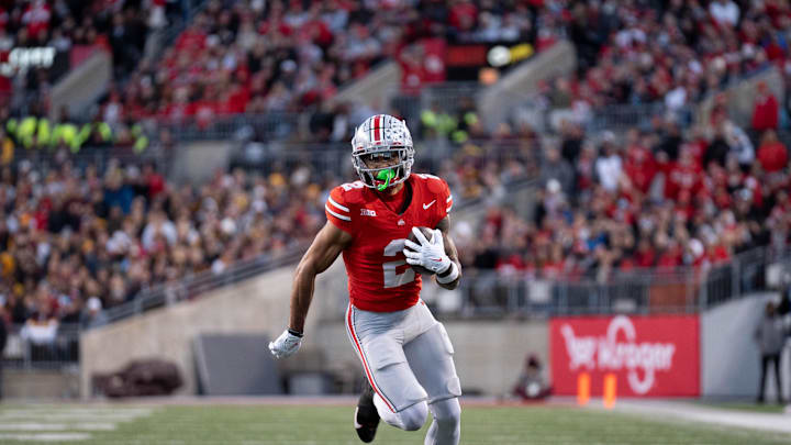 Nov 18, 2023; Columbus, Ohio, USA; 
Ohio State Buckeyes wide receiver Emeka Egbuka (2) runs down the field earning a first down against the Minnesota Golden Gophers during the first half of their game on Saturday, Nov. 18, 2023 at Ohio Stadium.
