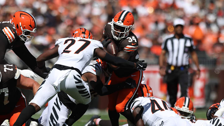 Sep 7, 2025; Cleveland, Ohio, USA; Cleveland Browns running back Jerome Ford (34) runs against Cincinnati Bengals safety Jordan Battle (27) during the second half at Huntington Bank Field. Mandatory Credit: Scott Galvin-Imagn Images