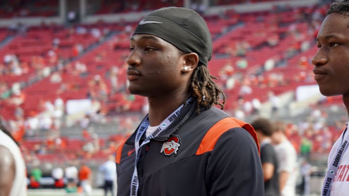 Sept. 21, 2024; Columbus, Ohio, USA; Glenville linebacker Cincere Johnson watches warm-ups before Ohio State's game against the Marshall University Thundering Herd at Ohio Stadium.
