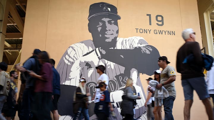 Apr 14, 2022; San Diego, California, USA; Fans walk the main concourse past a mural of former San Diego Padres player Tony Gwynn before the game between the Padres and the Atlanta Braves at Petco Park. Mandatory Credit: Orlando Ramirez-Imagn Images