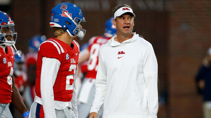 Oct 28, 2023; Oxford, Mississippi, USA; Mississippi Rebels head coach Lane Kiffin (right) talks with quarterback Jaxson Dart (2) during warm ups prior to the game against the Vanderbilt Commodores at Vaught-Hemingway Stadium. Mandatory Credit: Petre Thomas-USA TODAY Sports Oct 28, 2023; Oxford, Mississippi, USA; Mississippi Rebels head coach Lane Kiffin (right) talks with quarterback Jaxson Dart (2) during warm ups prior to the game against the Vanderbilt Commodores at Vaught-Hemingway Stadium. Mandatory Credit: Petre Thomas-USA TODAY Sports