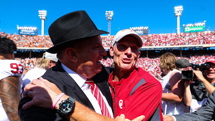 Oct 7, 2023; Dallas, Texas, USA;  Oklahoma Sooners head coach Brent Venables celebrates with athletic director Joe Castiglione after the game against the Texas Longhorns at the Cotton Bowl. Mandatory Credit: Kevin Jairaj-USA TODAY Sports