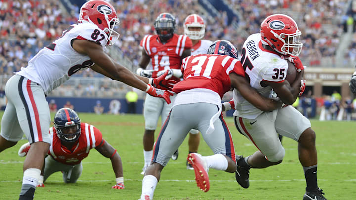 Sep 24, 2016; Oxford, MS, USA; Georgia Bulldogs running back Brian Herrien (35) gets past Mississippi Rebels linebacker Terry Caldwell (21) to score a touchdown during the third quarter of the game at Vaught-Hemingway Stadium. Mississippi won 45-14. Mandatory Credit: Matt Bush-Imagn Images