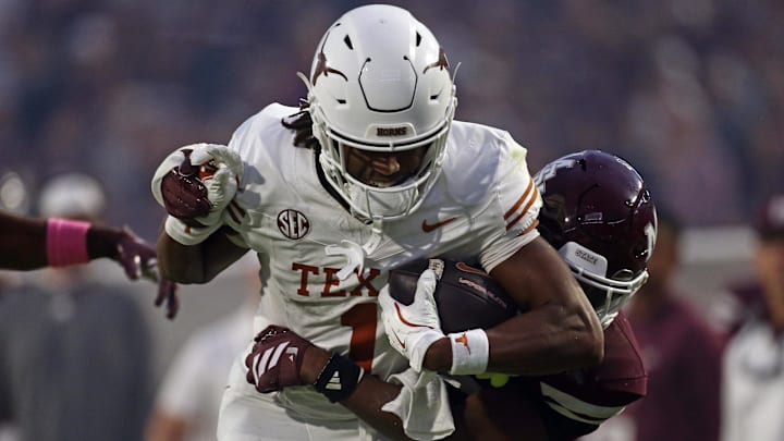 Texas Longhorns wide receiver Ryan Wingo runs after a catch as Mississippi State Bulldogs defensive back Jahron Manning (13) makes the tackle during the fourth quarter at Davis Wade Stadium at Scott Field. 
