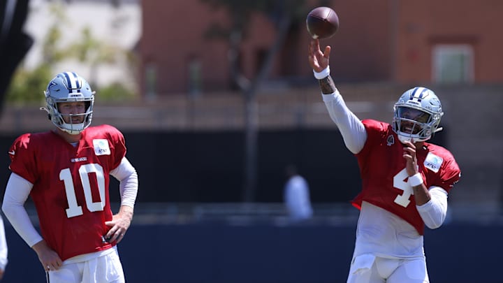 Jul 31, 2024; Oxnard, CA, USA; Dallas Cowboys quarterback Dak Prescott (4) throws next to quarterback Cooper Rush (10) during training camp at the River Ridge Playing Fields in Oxnard, California.  Mandatory Credit: Jason Parkhurst-Imagn Images