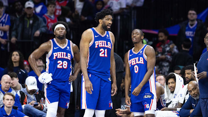Feb 20, 2025; Philadelphia, Pennsylvania, USA; Philadelphia 76ers center Joel Embiid (21) and guard Tyrese Maxey (0) talk in the final minute of the fourth quarter against the Boston Celtics at Wells Fargo Center. Mandatory Credit: Bill Streicher-Imagn Images