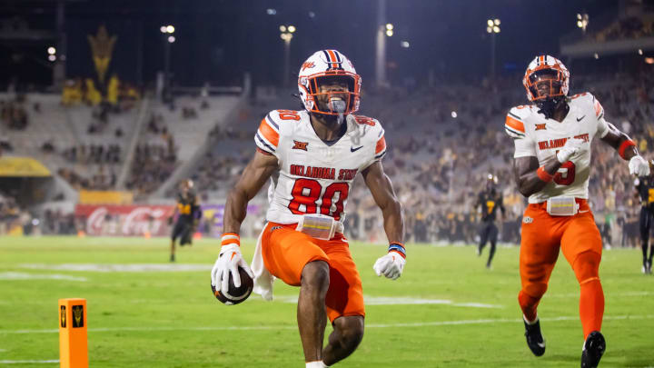 Sep 9, 2023; Tempe, Arizona, USA; Oklahoma State Cowboys wide receiver Brennan Presley (80) celebrates after scoring a touchdown against the Arizona State Sun Devils in the second half at Mountain America Stadium. Mandatory Credit: Mark J. Rebilas-USA TODAY Sports