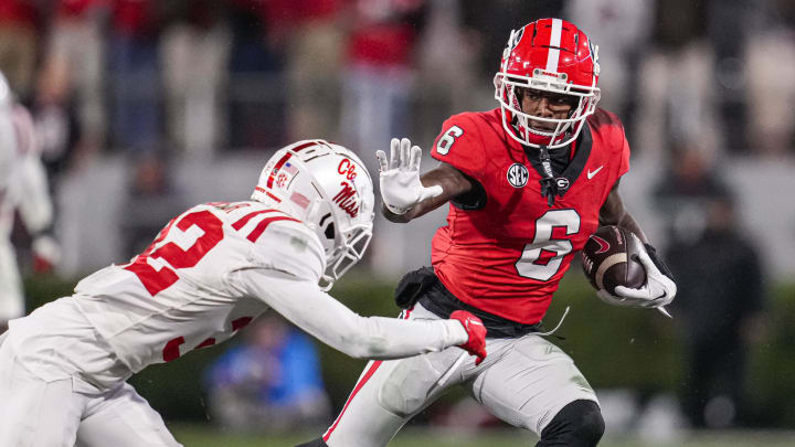 Nov 11, 2023; Athens, Georgia, USA; A Georgia Bulldogs wide receiver Dominic Lovett (6) runs against Mississippi Rebels cornerback Chris Graves Jr. (32) during the second half at Sanford Stadium. Mandatory Credit: Dale Zanine-USA TODAY Sports