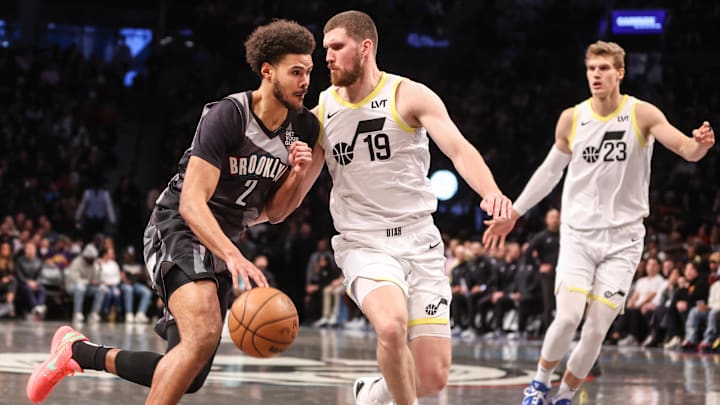 Dec 21, 2024; Brooklyn, New York, USA;  Brooklyn Nets forward Cameron Johnson (2) controls the ball against Utah Jazz guard Svi Mykhailiuk (19) in the second quarter at Barclays Center. Mandatory Credit: Wendell Cruz-Imagn Images