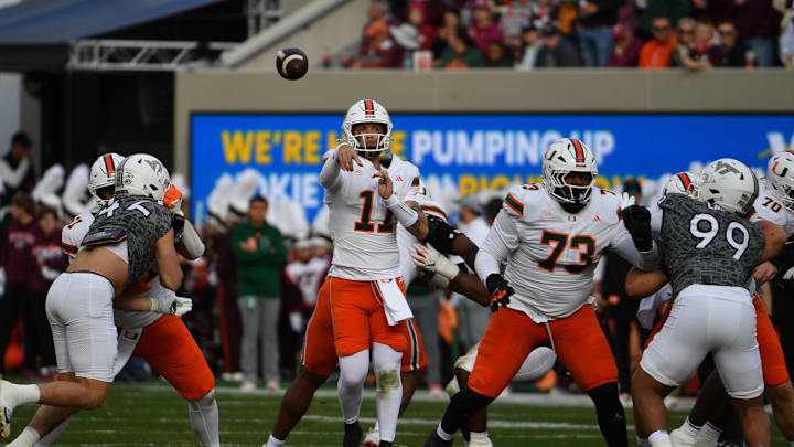 Nov 22, 2025; Blacksburg, Virginia, USA; Miami (FL) Hurricanes quarterback Carson Beck (11) throws a pass against the Virginia Tech Hokies during the second quarter at Lane Stadium. Mandatory Credit: Brian Bishop-Imagn Images
