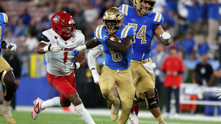 Sep 12, 2025; Pasadena, California, USA; UCLA Bruins running back Anthony Woods (6) runs with the ball during the second quarter against the New Mexico Lobos at Rose Bowl. Mandatory Credit: Kiyoshi Mio-Imagn Images Sep 12, 2025; Pasadena, California, USA; UCLA Bruins running back Anthony Woods (6) runs with the ball during the second quarter against the New Mexico Lobos at Rose Bowl. Mandatory Credit: Kiyoshi Mio-Imagn Images