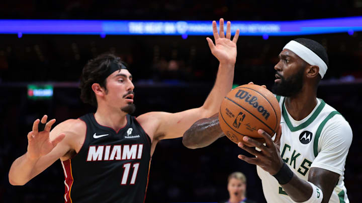 Mar 12, 2026; Miami, Florida, USA; Milwaukee Bucks forward Bobby Portis (9) protects the basketball from Miami Heat forward Jaime Jaquez Jr. (11) during the second quarter at Kaseya Center. Mandatory Credit: Sam Navarro-Imagn Images