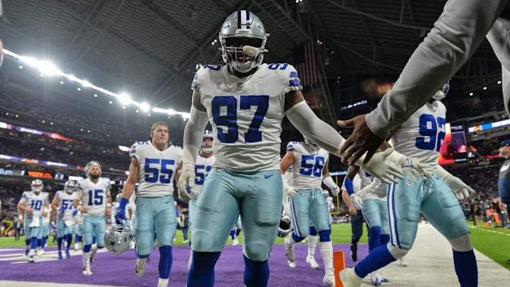 Oct 31, 2021; Minneapolis, Minnesota, USA; Dallas Cowboys defensive tackle Osa Odighizuwa (97) and outside linebacker Leighton Vander Esch (55) and teammates head for the locker room before the game against the Minnesota Vikings at U.S. Bank Stadium. Mandatory Credit: Jeffrey Becker-Imagn Images