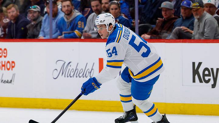 Apr 5, 2026; Denver, Colorado, USA; St. Louis Blues right wing Dalibor Dvorsky (54) controls the puck in the first period against the Colorado Avalanche at Ball Arena. Mandatory Credit: Isaiah J. Downing-Imagn Images