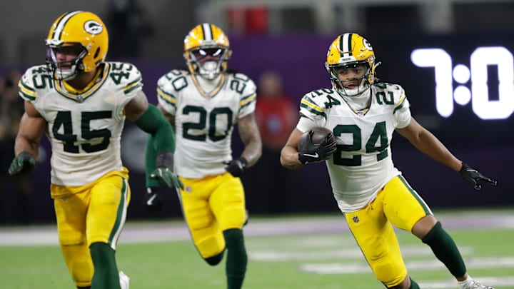 Green Bay Packers cornerback Carrington Valentine (24) runs back an interception against the Minnesota Vikings in the third quarter during their football game Sunday, December 29, 2024, at U.S. Bank Stadium in Minneapolis, Minnesota.