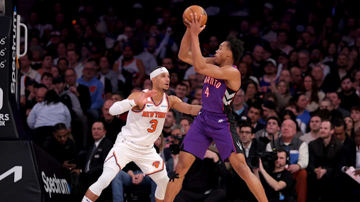 Jan 8, 2025; New York, New York, USA; Toronto Raptors forward Scottie Barnes (4) looks to pass the ball against New York Knicks guard Josh Hart (3) during the third quarter at Madison Square Garden. Mandatory Credit: Brad Penner-Imagn Images
