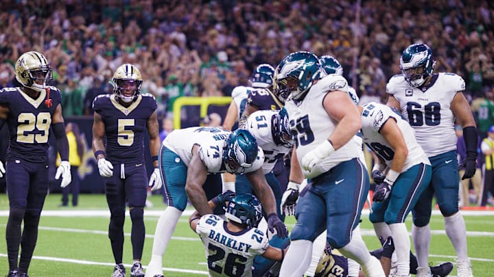 Sep 22, 2024; New Orleans, Louisiana, USA; Philadelphia Eagles running back Saquon Barkley (26) rushes in for touchdown against New Orleans Saints defensive tackle Nathan Shepherd (93) during the second half at Caesars Superdome. Sep 22, 2024; New Orleans, Louisiana, USA; Philadelphia Eagles running back Saquon Barkley (26) rushes in for touchdown against New Orleans Saints defensive tackle Nathan Shepherd (93) during the second half at Caesars Superdome.