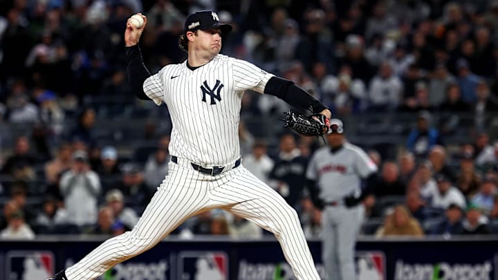 Oct 15, 2024; Bronx, New York, USA; New York Yankees pitcher Gerrit Cole (45) throws a pitch during the first inning against the Cleveland Guardians in game two of the ALCS for the 2024 MLB Playoffs at Yankee Stadium.