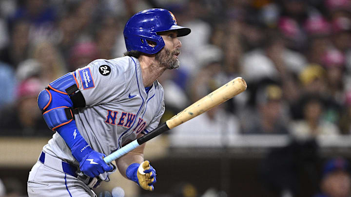 Aug 22, 2024; San Diego, California, USA; New York Mets right fielder Jeff McNeil (1) hits an RBI single against the San Diego Padres during the fourth inning at Petco Park. Mandatory Credit: Orlando Ramirez-Imagn Images