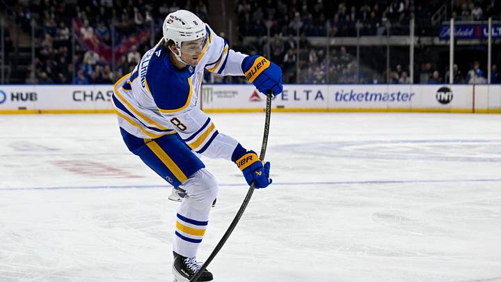 Apr 8, 2026; New York, New York, USA; Buffalo Sabres defenseman Michael Kesselring (8) attempts a shot against the New York Rangers during the first period at Madison Square Garden. Mandatory Credit: Dennis Schneidler-Imagn Images