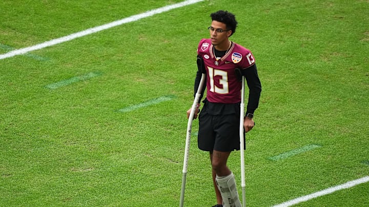 Dec 30, 2023; Miami Gardens, FL, USA; Florida State Seminoles quarterback Jordan Travis (13) before