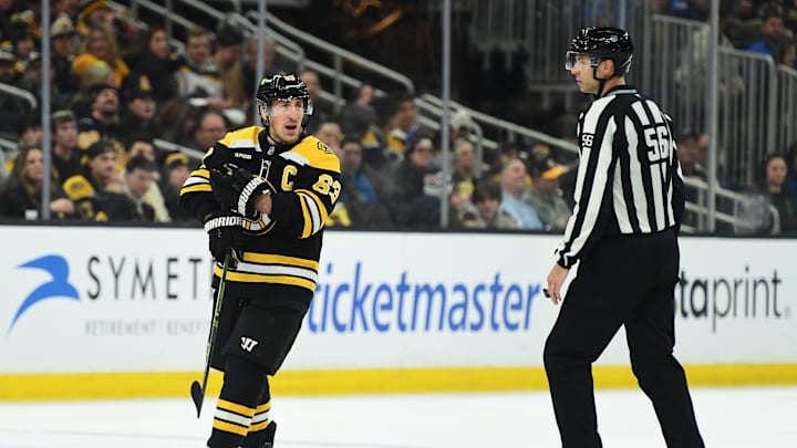Feb 27, 2025; Boston, Massachusetts, USA; Boston Bruins left wing Brad Marchand (63) reacts to a a penalty call during the third period against the New York Islanders at TD Garden. Mandatory Credit: Bob DeChiara-Imagn Images