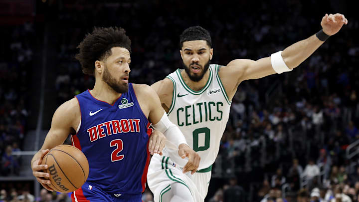 Feb 26, 2025; Detroit, Michigan, USA;  Detroit Pistons guard Cade Cunningham (2) dribbles on Boston Celtics forward Jayson Tatum (0) in the second half at Little Caesars Arena. Mandatory Credit: Rick Osentoski-Imagn Images
