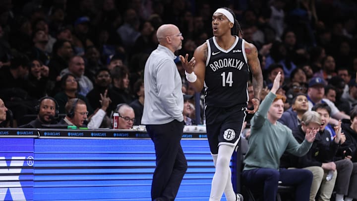 Feb 24, 2026; Brooklyn, New York, USA; Brooklyn Nets guard Terance Mann (14) reacts after making a three point shot in the fourth quarter against the Dallas Mavericks at Barclays Center. Mandatory Credit: Wendell Cruz-Imagn Images