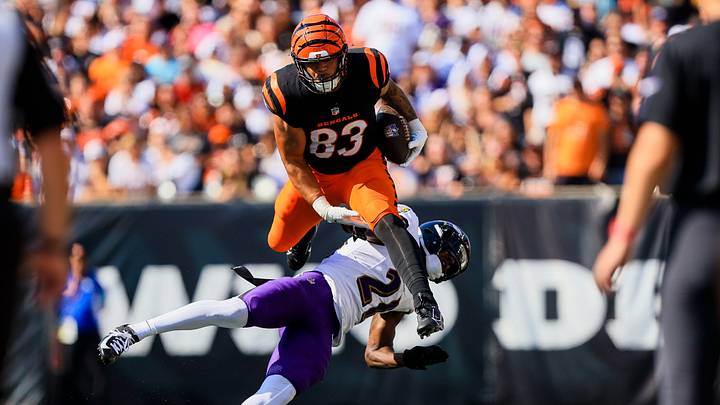 Oct 6, 2024; Cincinnati, Ohio, USA; Cincinnati Bengals tight end Erick All Jr. (83) hurdles over Baltimore Ravens cornerback Brandon Stephens (21) in the second half at Paycor Stadium. Mandatory Credit: Katie Stratman-Imagn Images