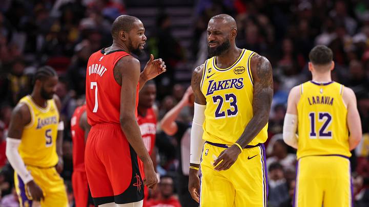 Mar 16, 2026; Houston, Texas, USA; Houston Rockets forward Kevin Durant (7) talks with Los Angeles Lakers forward LeBron James (23) on the court during the second quarter at Toyota Center. Mandatory Credit: Troy Taormina-Imagn Images