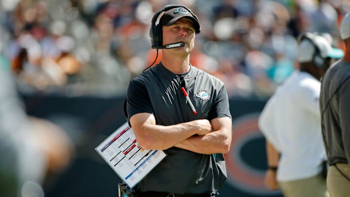 Aug 14, 2021; Chicago, Illinois, USA; Miami Dolphins defensive coordinator Josh Boyer watches the game against the Chicago Bears from the sideline during the second half at Soldier Field. Mandatory Credit: Jon Durr-Imagn Images