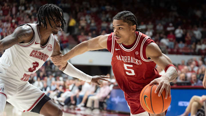 Feb 18, 2026; Tuscaloosa, AL, USA; Arkansas guard Darius Acuff Jr. (5) drives against Alabama guard Latrell Wrightsell Jr. (3) at Coleman Coliseum. Alabama defeated Arkansas 117-115 in double overtime. Mandatory Credit: Gary Cosby Jr.-Tuscaloosa News